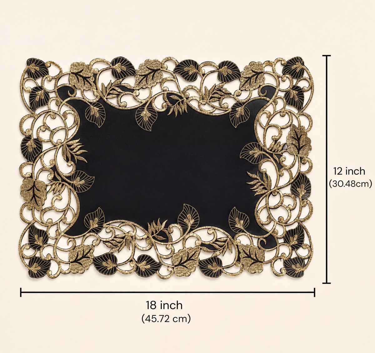 a decorative black and gold frame with intricate floral patterns.