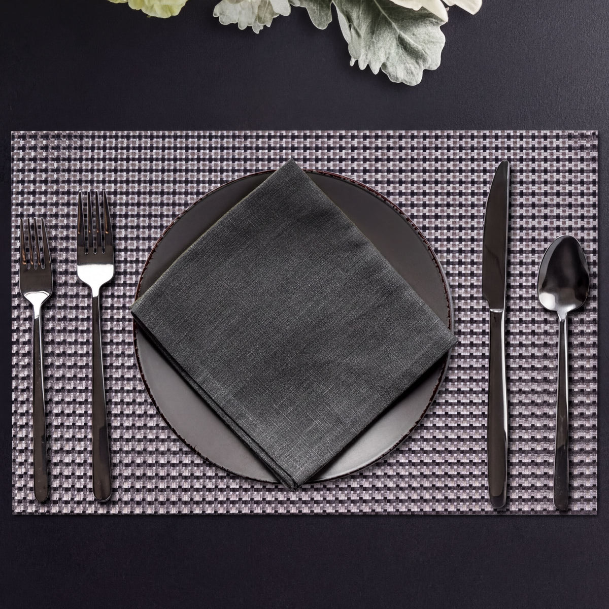 Set of four PVC placemats for dining tables, durable and stylish table protectors from brand 44334.