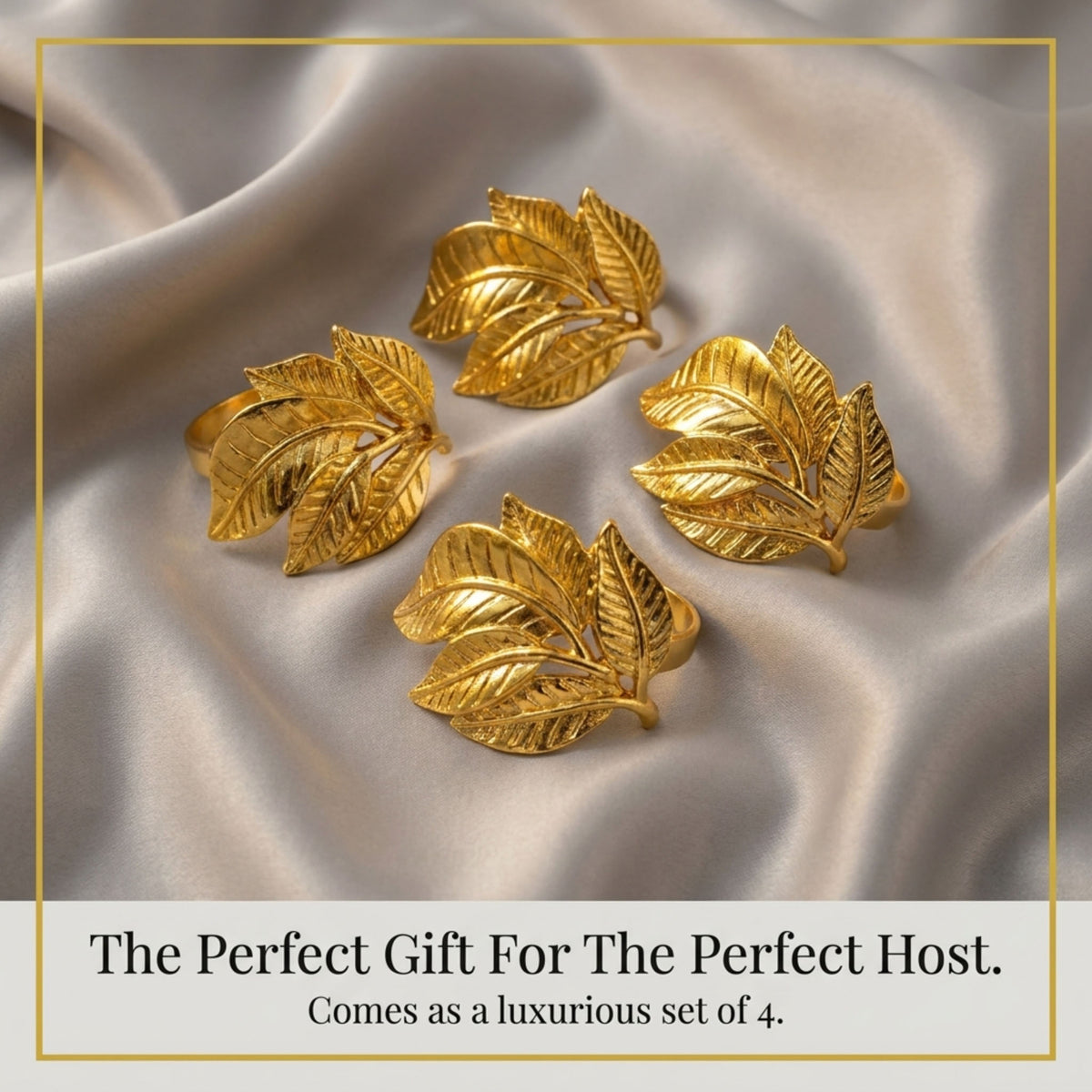 a set of four gold leaf-shaped napkin rings arranged on a textured gray background.