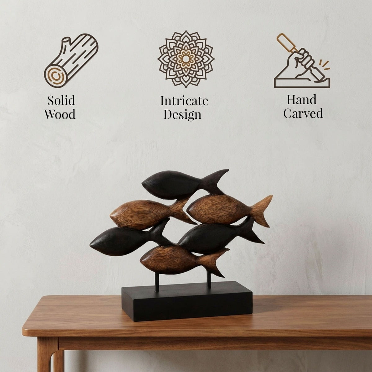 a wooden sculpture of a fish, with three different design elements displayed above it.