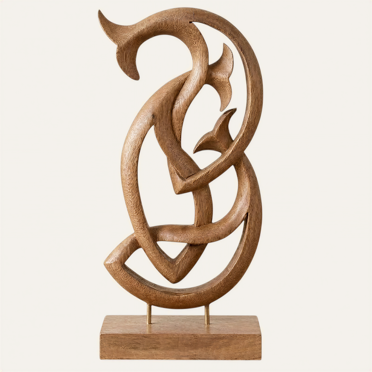a wooden sculpture with an abstract, organic design.