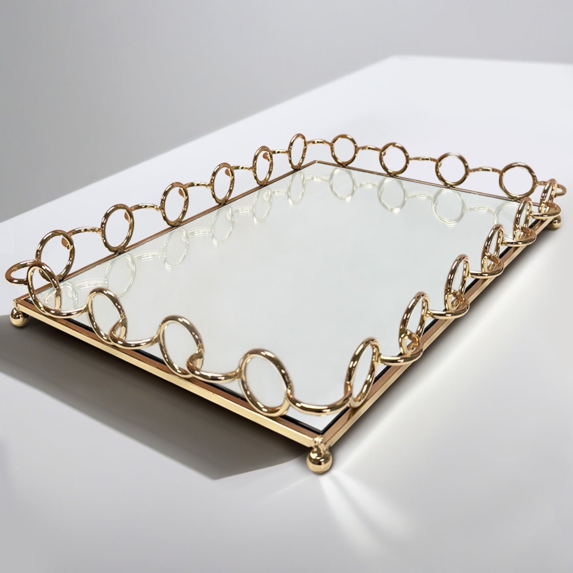 Glass serving tray with elegant ring accents, ideal for kitchen décor and entertaining, featuring a sleek transparent design.
