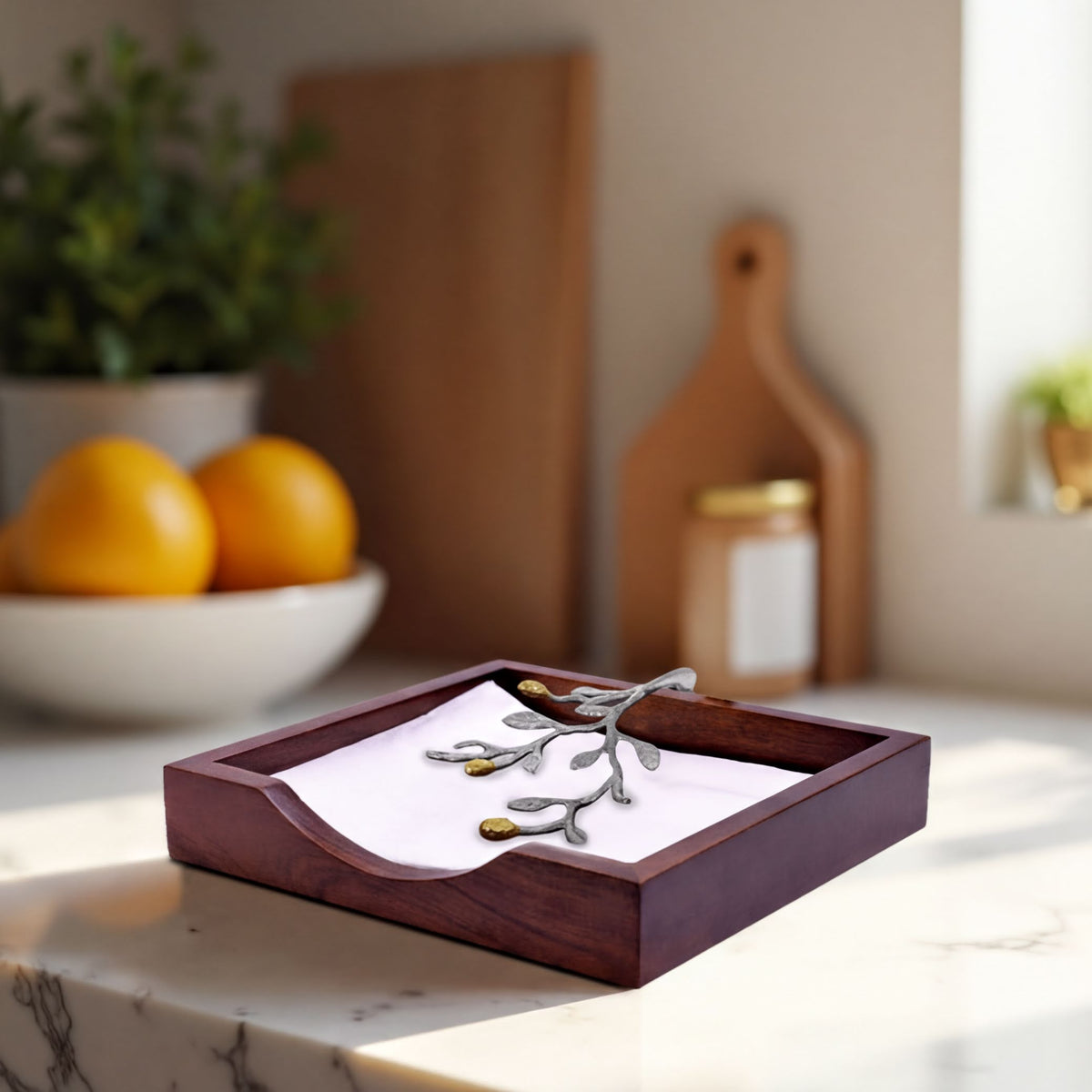 Solid wood napkin holder with silver and gold finish ornament, designed for elegant table and kitchen use.