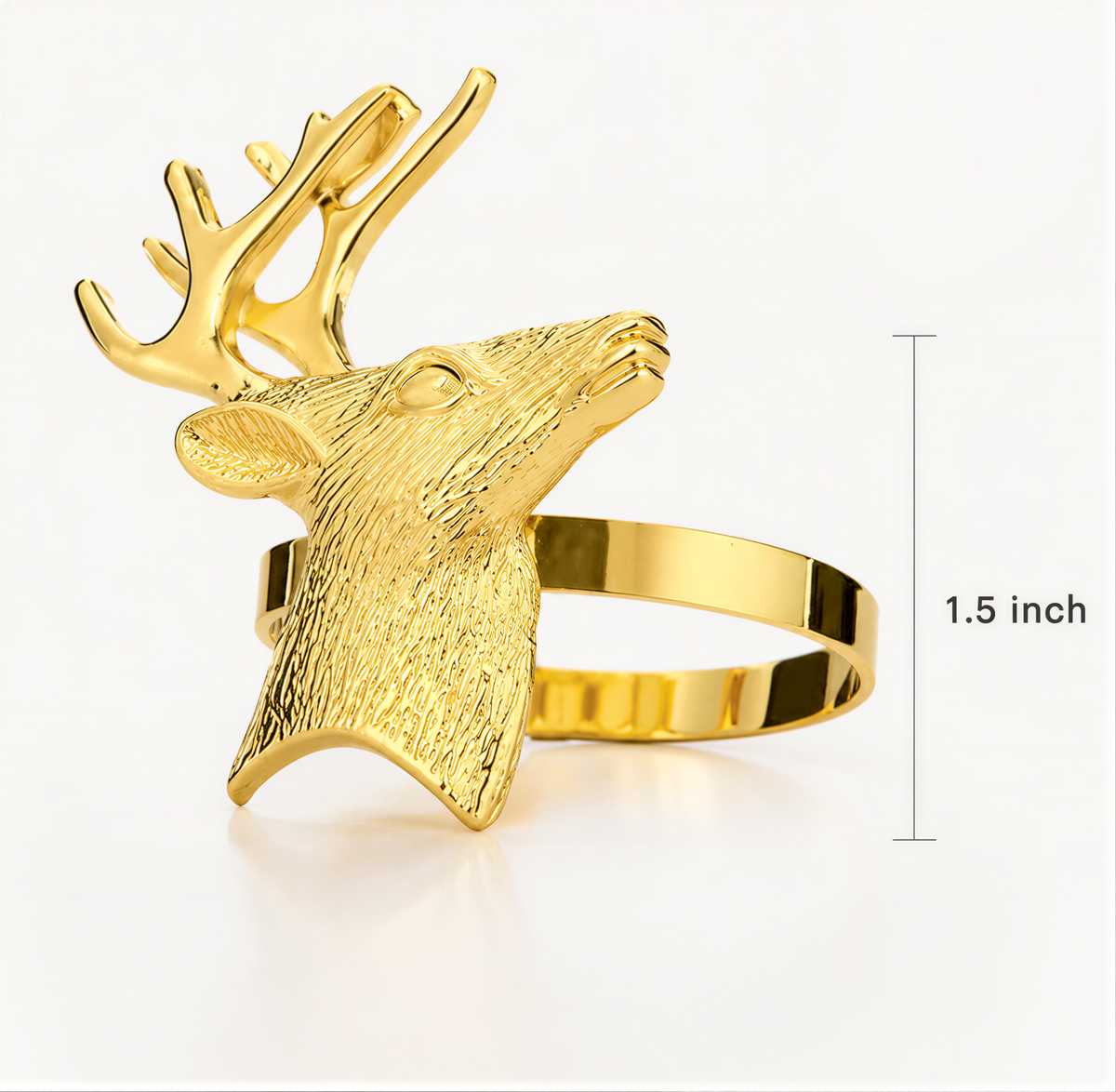 A gold-colored metal ring in the shape of a deer head, with antlers on top.