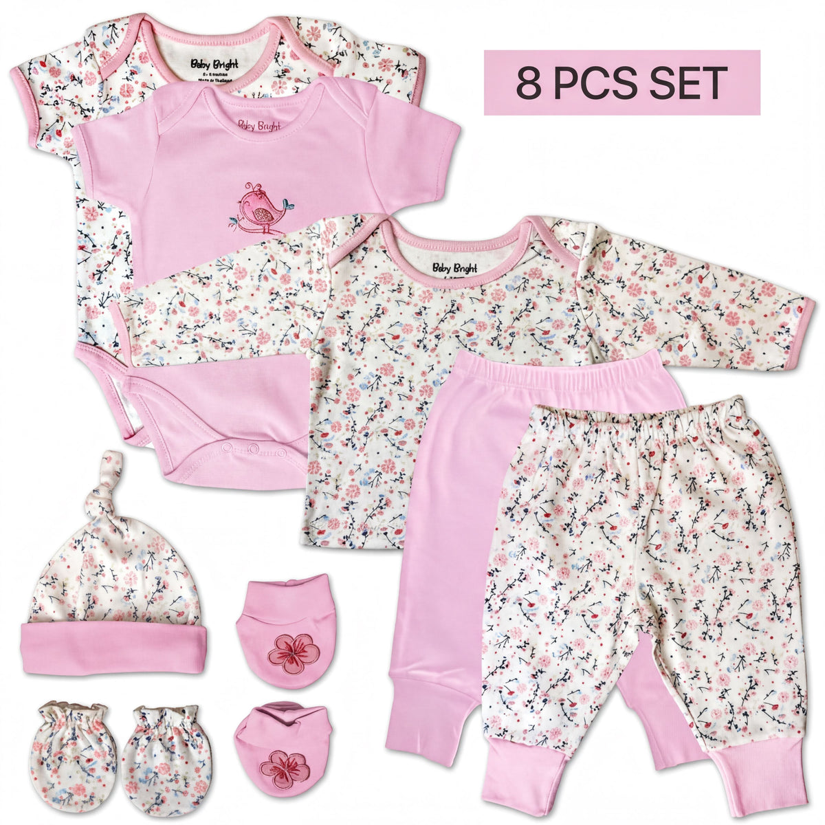 A set of baby clothing items, including a pink onesie, pants, a hat, and booties, arranged on a white background.