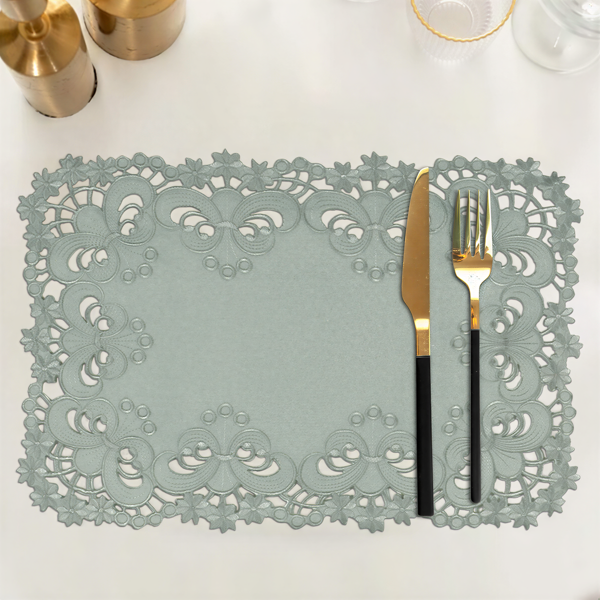 Set of six linen placemats with European embroidery from The Creola Collection, featuring detailed decorative stitching.