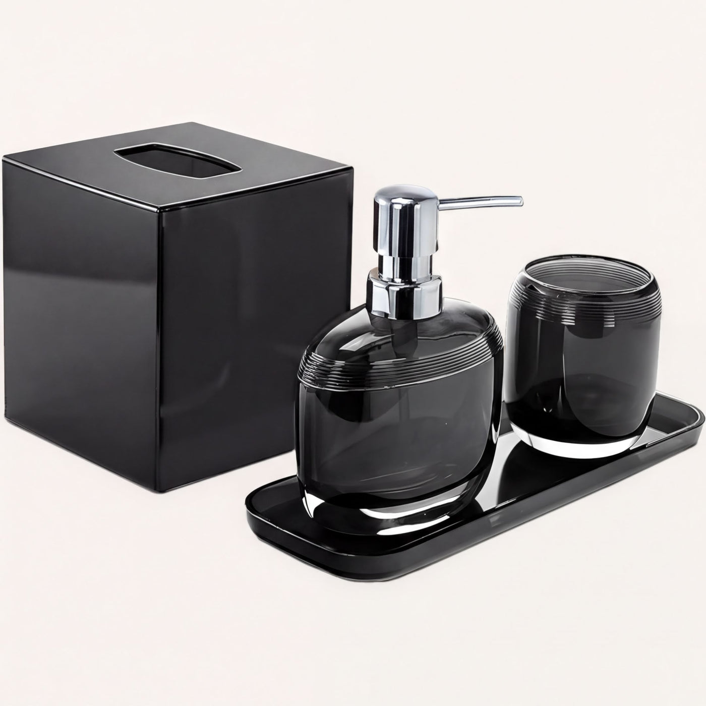 Set of four modern bathroom décor accessories from The Aurik Collection, including soap dispenser, toothbrush holder, and matching containers.
