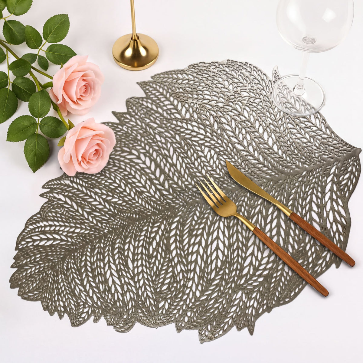 Set of six leaf cut out vinyl placemats by AMF033-GLD, decorative table protectors with intricate leaf design.