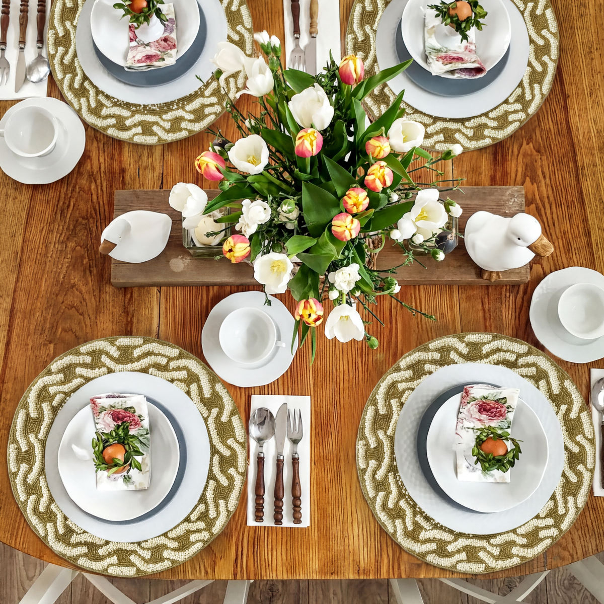 Embroidered beaded placemats from The Floy, featuring intricate beadwork and colorful embroidery for elegant table decor.