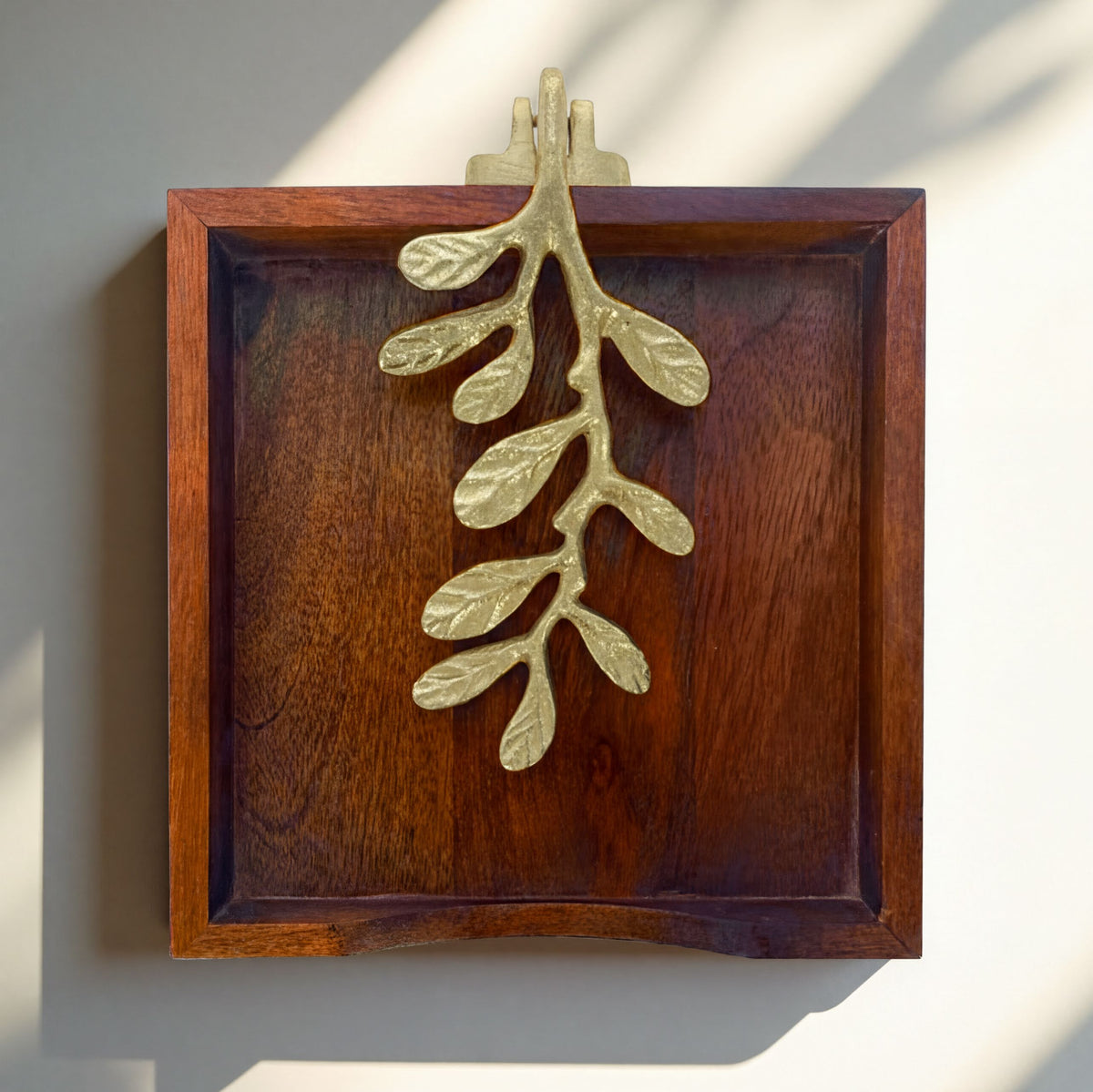Solid wood napkin holder with gold finish ornament, stylish and functional napkin dispenser for elegant table settings.
