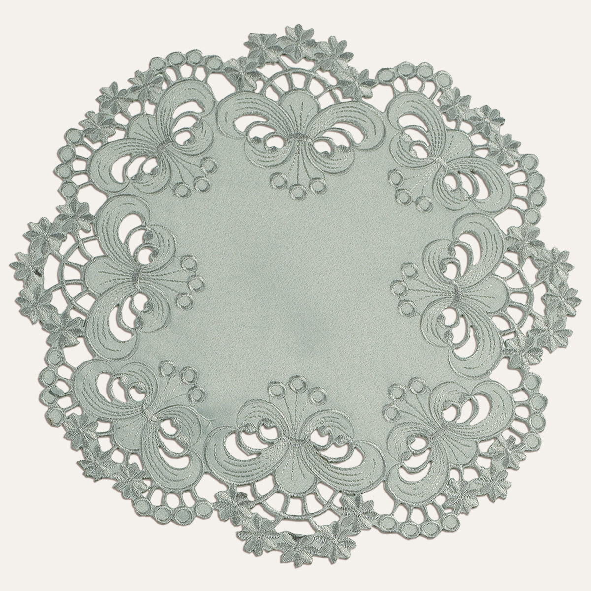 Set of four gray round linen placemats and doilies from The Creola Collection by FL3412-DL, featuring elegant textile details.