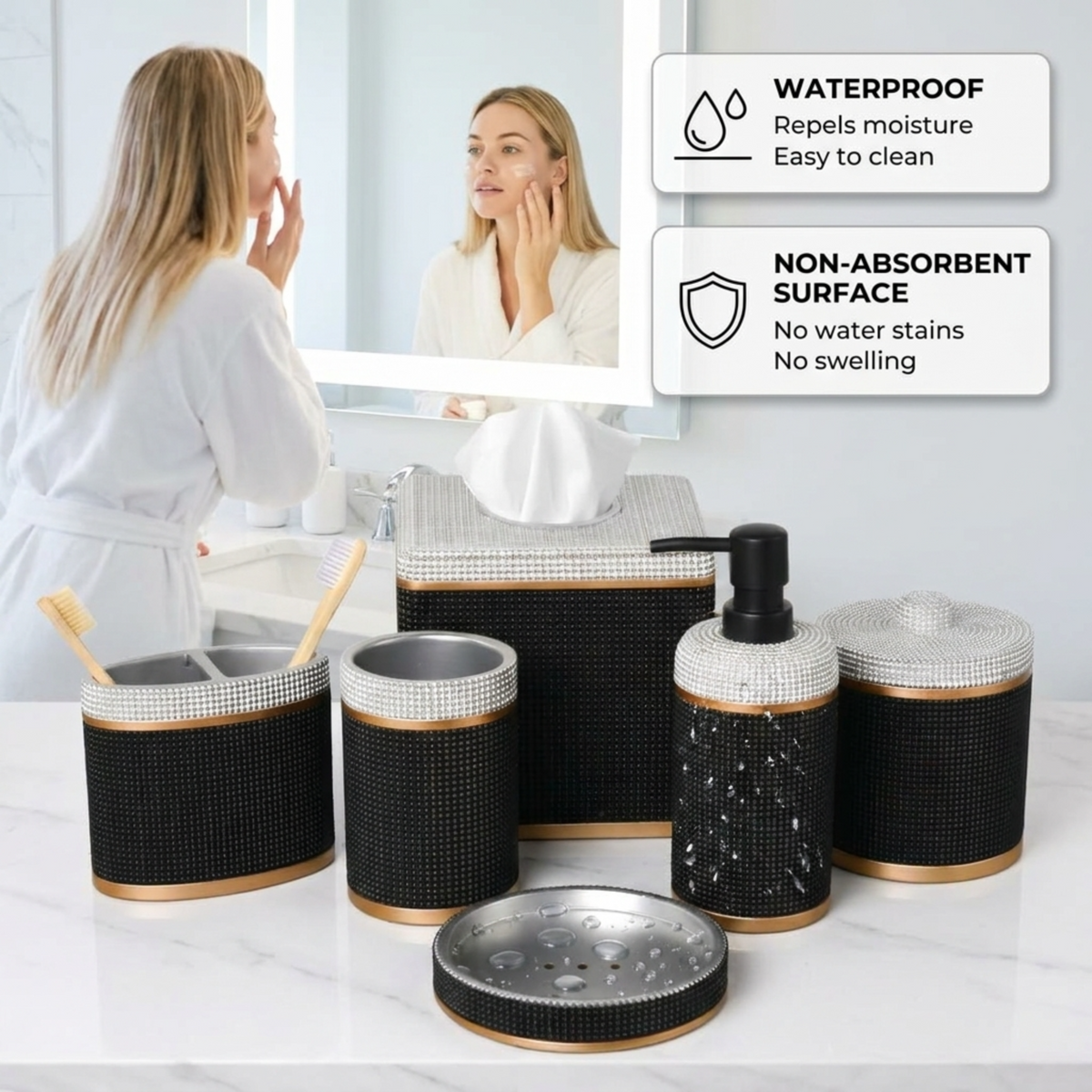 a woman standing in front of a bathroom mirror, with a set of black and gold bathroom accessories placed on a countertop in front of her.