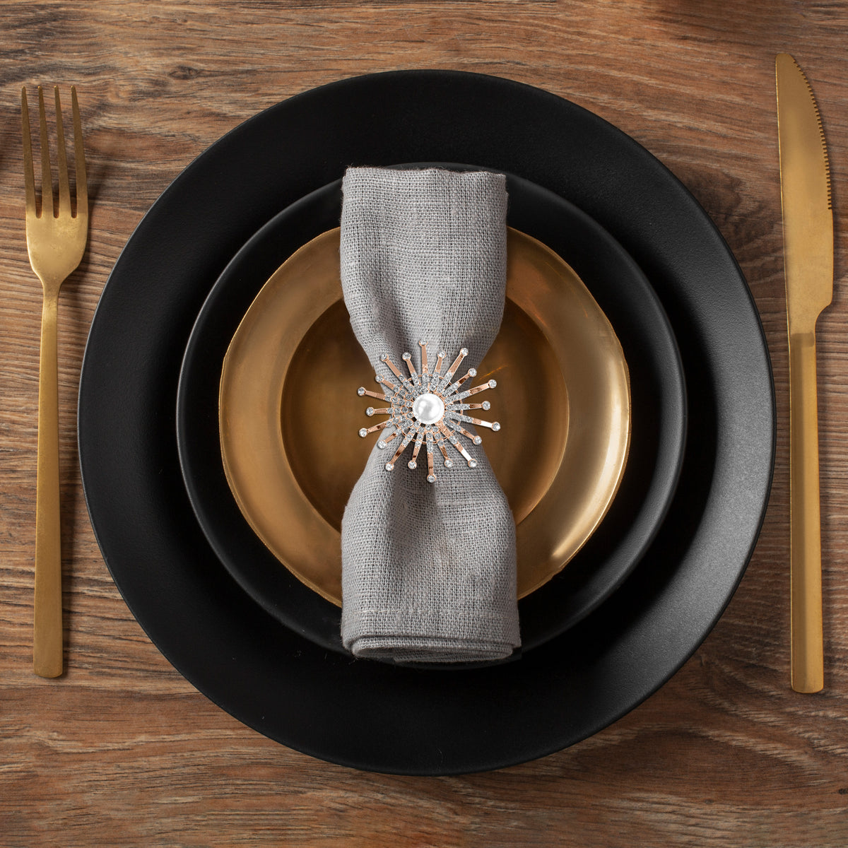 Set of four ZWZ Golden Blossom napkin rings with gold floral and pearl design, elegant decorative table accessories.