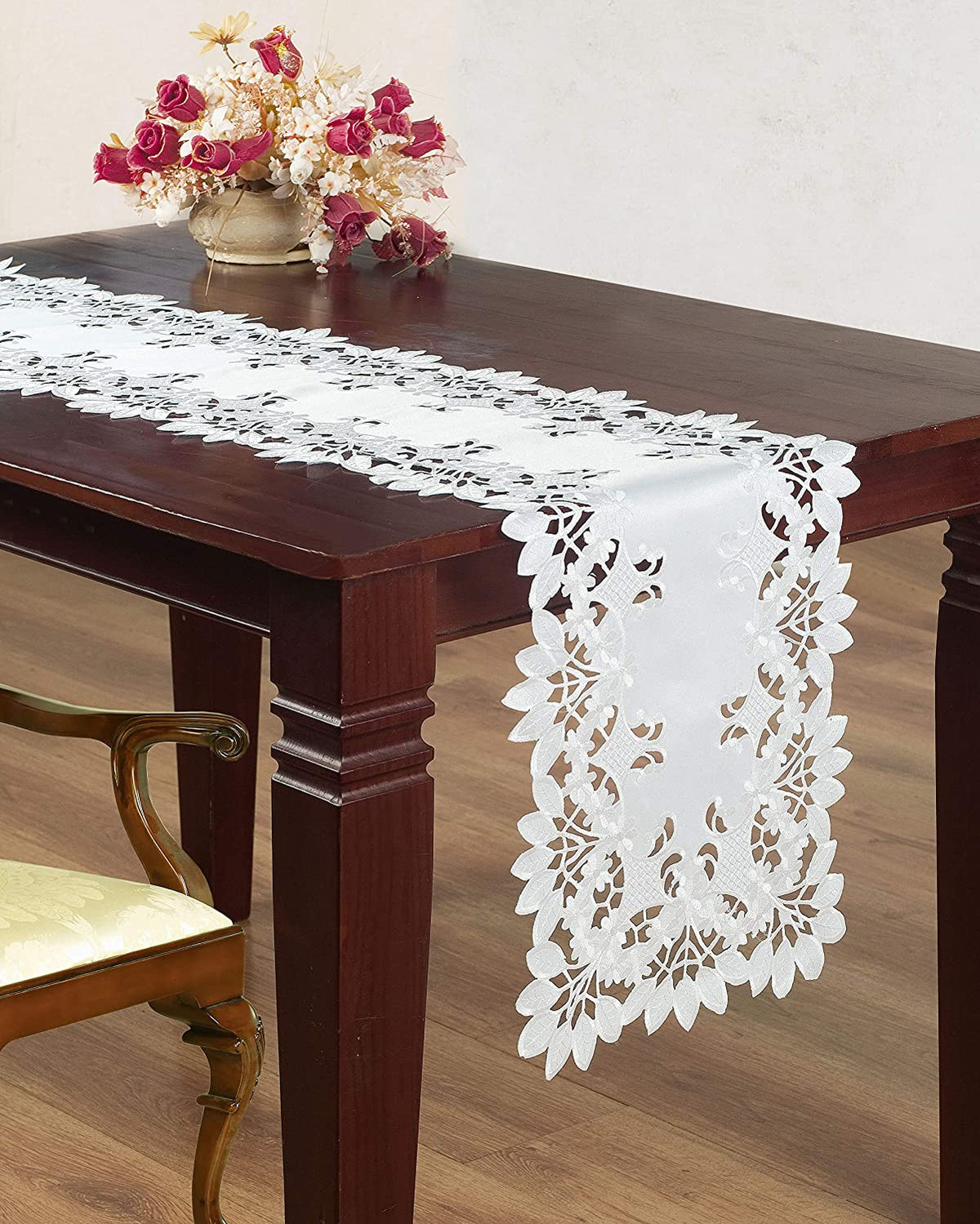 Linen table runner with intricate European embroidery from The Deandra Collection, featuring elegant floral patterns.