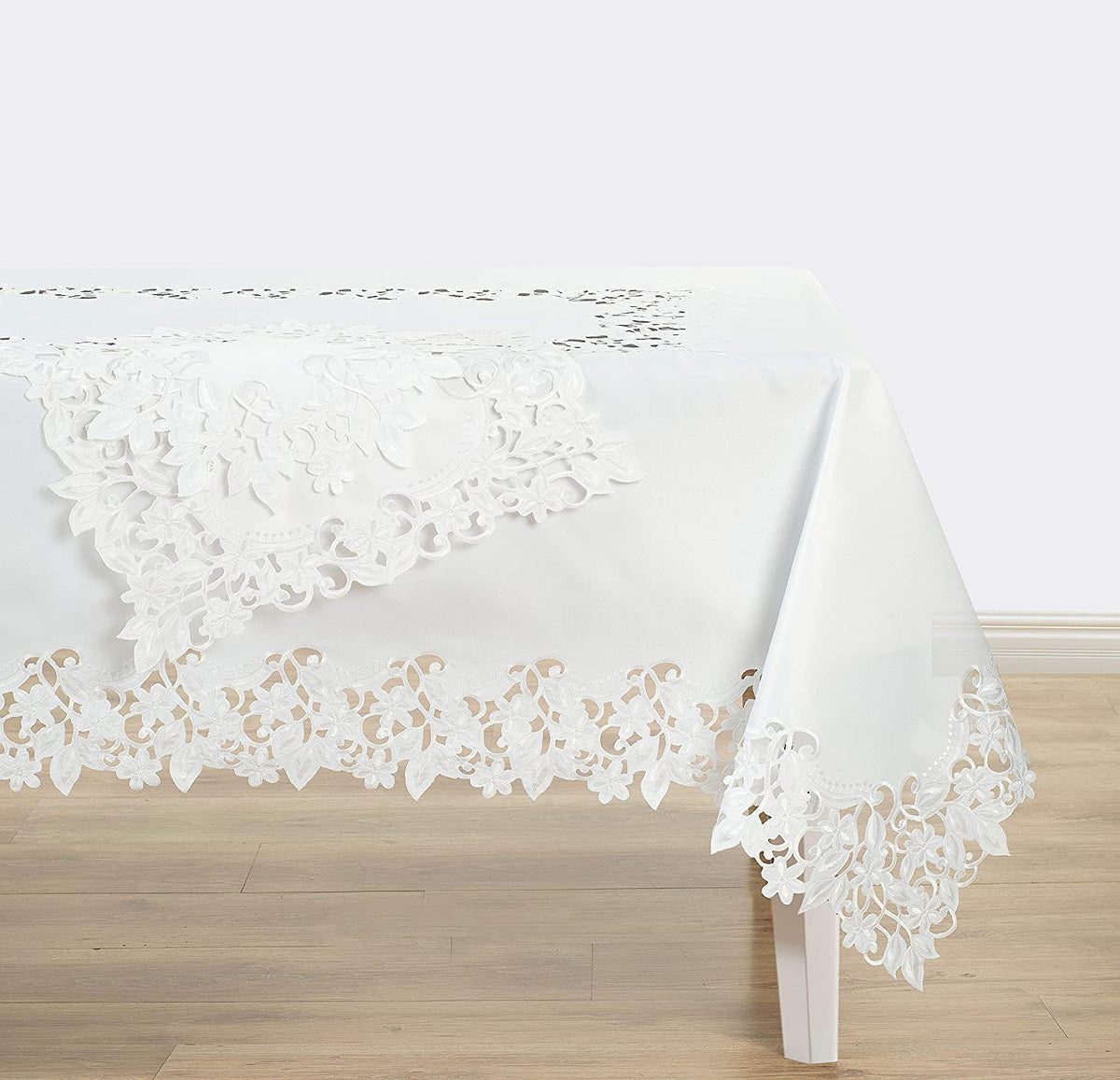Linen table runner with intricate European embroidery from The Deandra Collection, showcasing detailed craftsmanship.