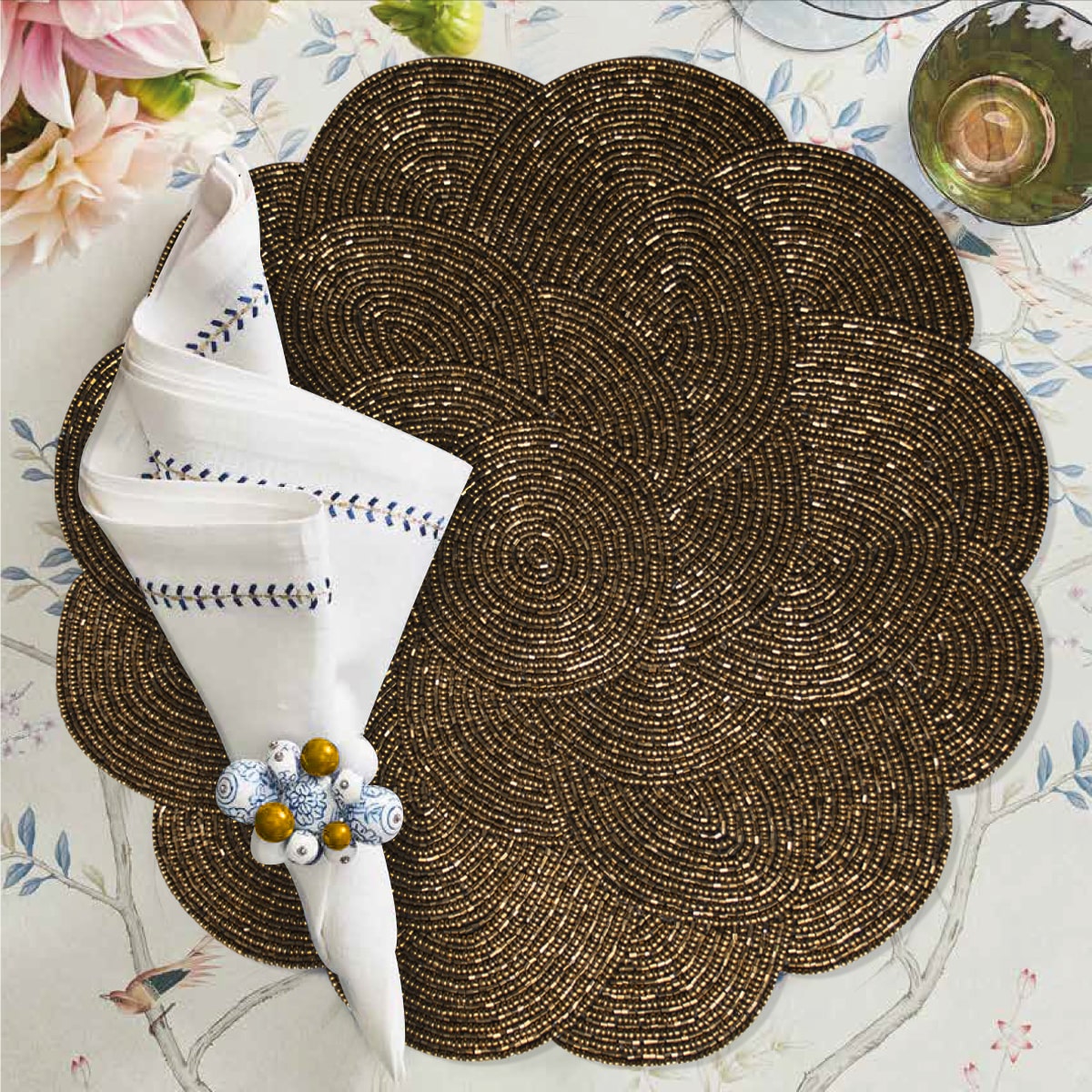 Set of 2 embroidered beaded placemats with festive poinsettia design, ideal for holiday dining decor.