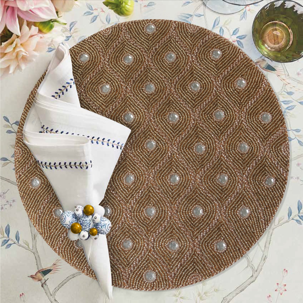 Set of 2 embroidered beaded placemats with festive poinsettia design, featuring intricate beadwork for holiday table decor.