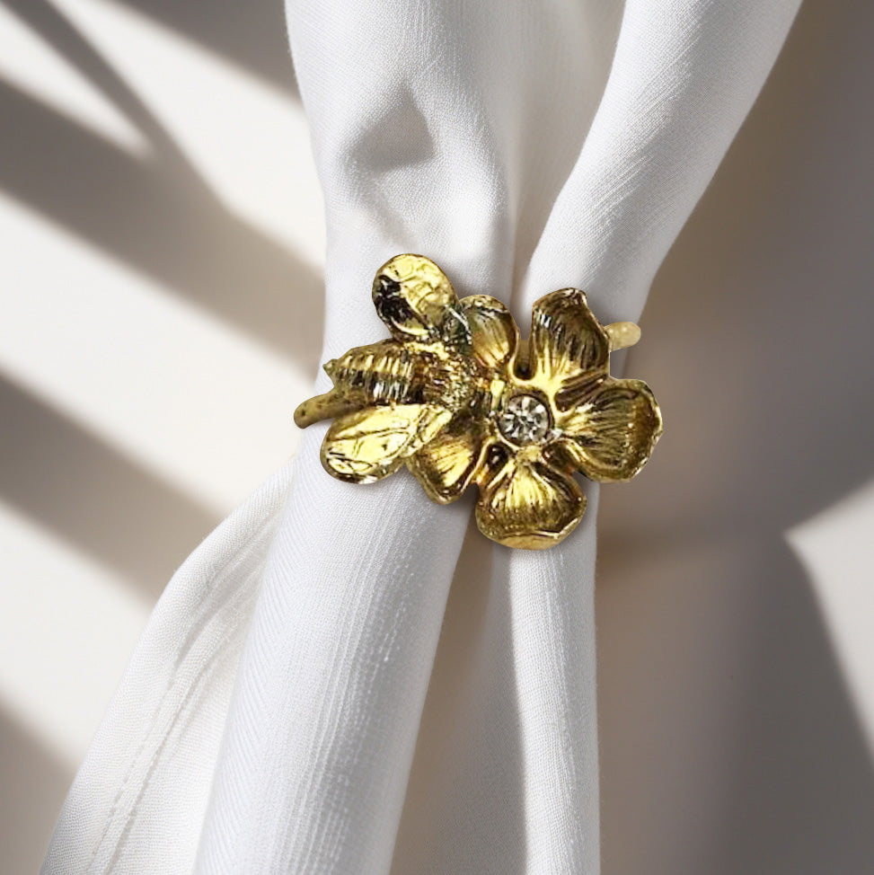 Set of four gold bee design napkin rings by 0024A171107, elegant tableware accessories with intricate bee detailing.