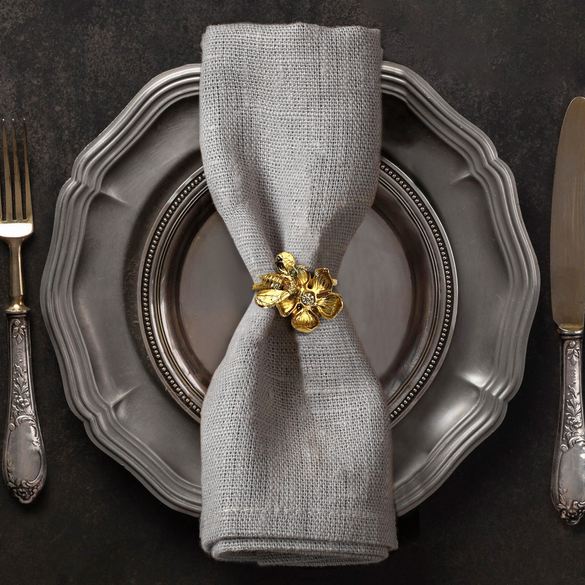 Set of four gold bee design napkin rings by 0024A171107, elegant accessories for stylish table settings