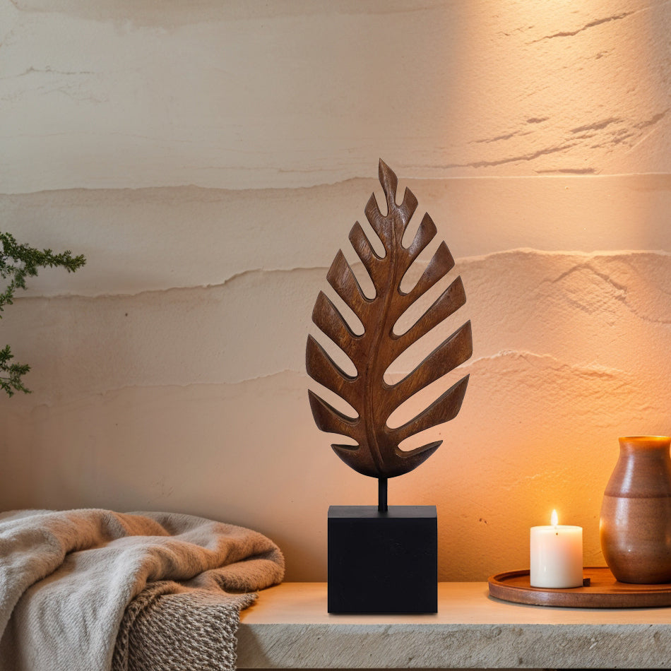 Hand-carved wooden sculpture of a leaf by Madilyn Leaf, artistic wooden décor piece for home decoration or gift.