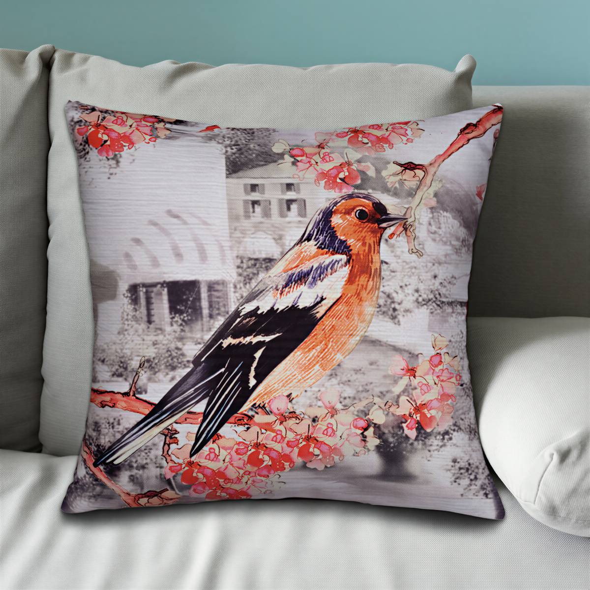 A decorative throw pillow with a colorful illustration of a bird perched on a branch with flowers.