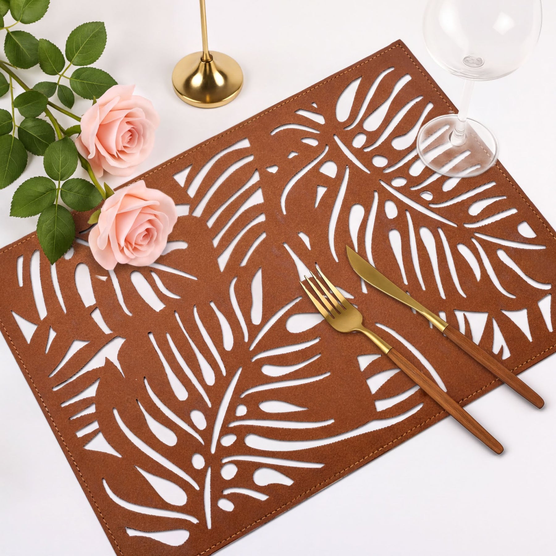 Set of six Monstera leaf cut out leather placemats by ACM1247-BRN, featuring stylish tropical leaf design for table decor.