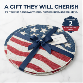 A gift wrapped in a blue ribbon, featuring a patriotic design of red, white, and blue stripes and stars, with a tag indicating it is a hand-beaded mat set.