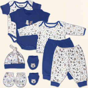 A collection of baby clothing and accessories, including a blue onesie, blue pants, a blue hat, and baby mittens, all featuring a pattern of animals and bears.