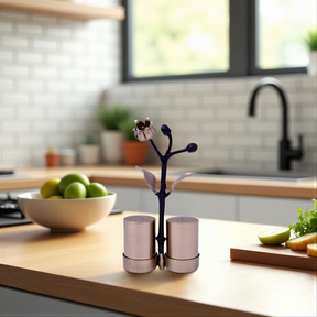 Etched salt and pepper shaker set for kitchen décor, featuring detailed designs in a stylish metal finish.
