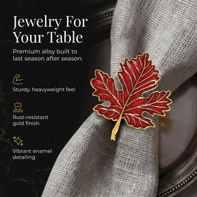 a red leaf-shaped napkin ring on a gray fabric napkin, with a black background.