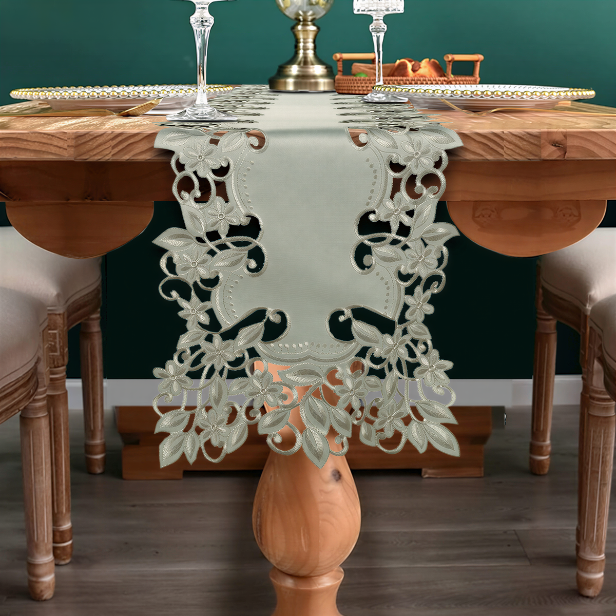a wooden dining table with a decorative table runner, two chairs, and a glass of wine.