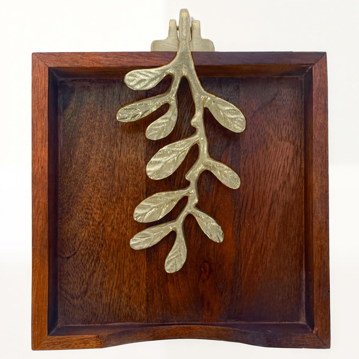 Solid wood napkin holder with a gold finish ornament, stylish and functional for kitchen or dining table use.