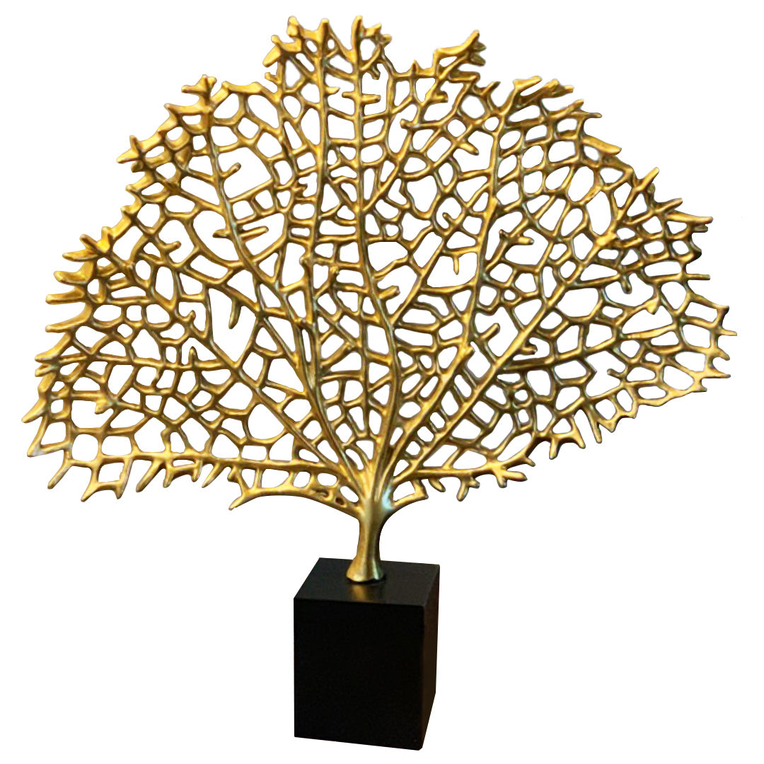 a large, intricate, and golden-colored sculpture of a tree or plant, displayed on a black base.