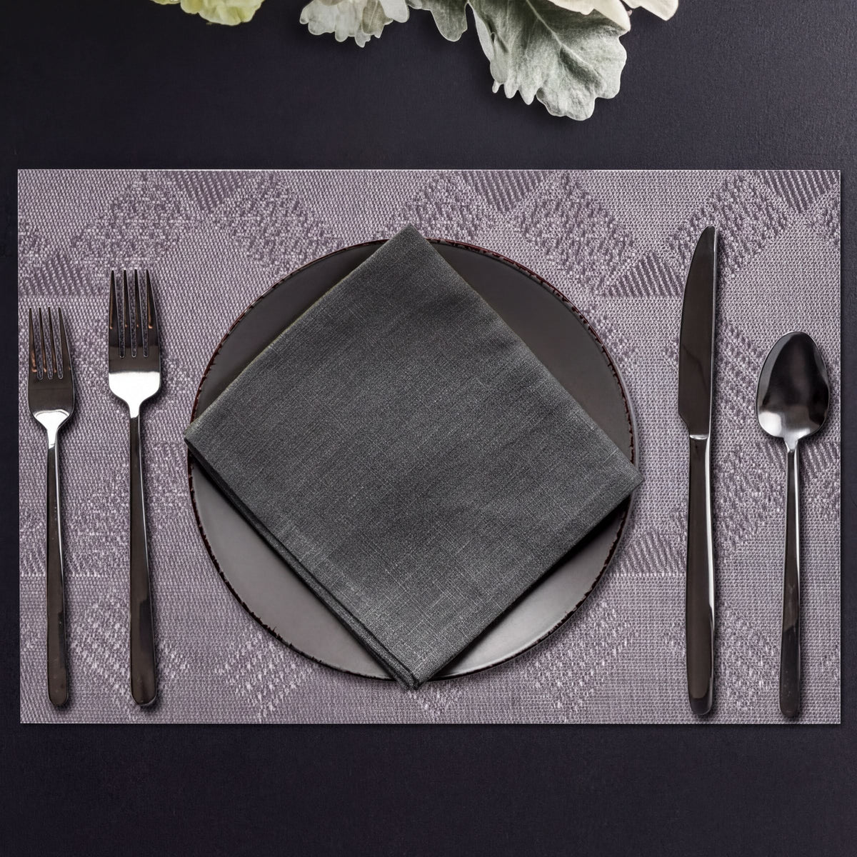Set of four PVC placemats for dining table, featuring durable, easy-to-clean surface ideal for protecting your table.