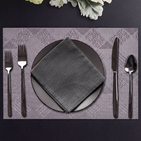 Set of four PVC placemats for dining table, featuring durable, easy-to-clean surface ideal for protecting your table.