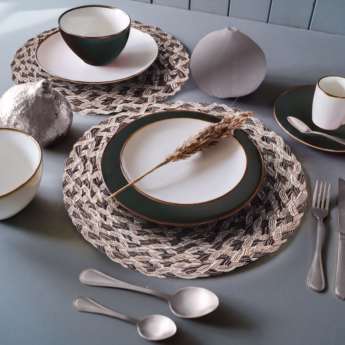 Set of six round PVC placemats with cut-out design, ideal for protecting tables and adding decorative style.