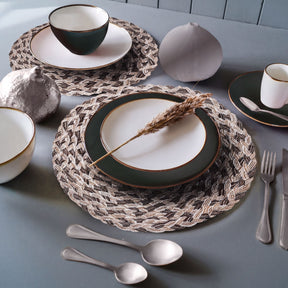 Set of six round PVC placemats with cut-out design, ideal for protecting tables and adding decorative style.