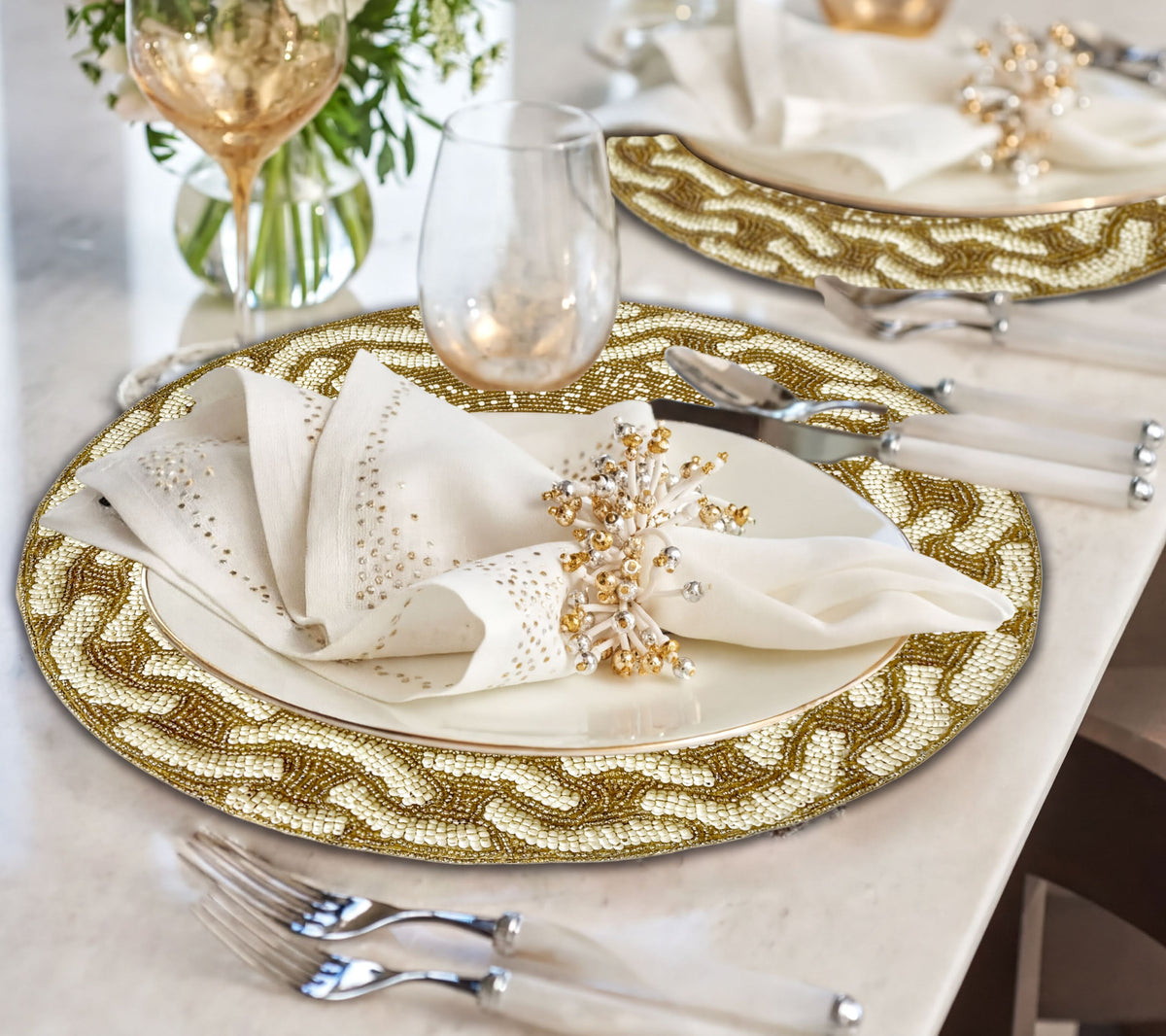 Embroidered beaded placemats from The Floy in a pack of one, featuring intricate beadwork and elegant design for table setting.