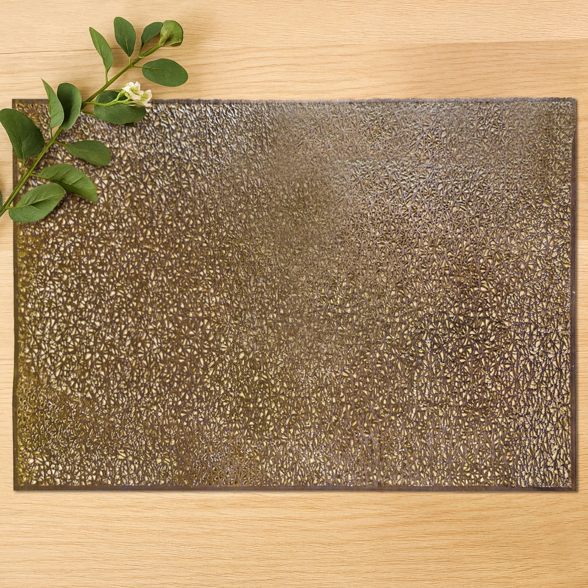 Set of six gold PVC cut-out placemats with intricate designs, ideal for protecting tables and adding decorative appeal.