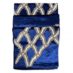 Embroidered decorative table runner with intricate patterns, designed for elegant dining tables.