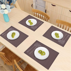 Set of four Cambridge Brown vinyl PVC placemats, heat and scratch resistant for dining tables.