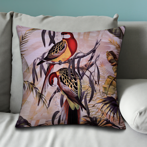 A decorative throw pillow with a vibrant, colorful print of two birds perched on branches, surrounded by tropical foliage.