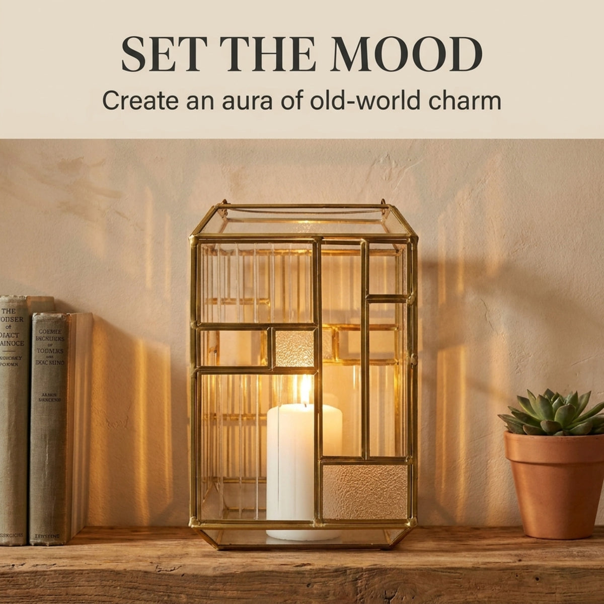 Gold metal frame and glass candle holder lantern with a classic design, perfect for decorative lighting.