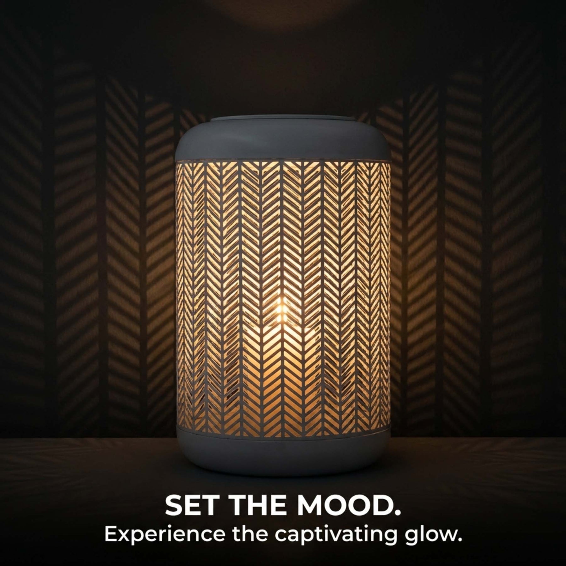 White lattice pattern glass candle lantern with metal frame, ideal for decorative lighting and ambient decor.