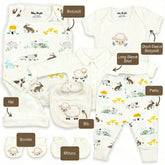 A collection of baby clothing and accessories, including a white onesie, a long-sleeve shirt, a short-sleeve shirt, a hat, a bib, mittens, and booties, all featuring a sheep and rabbit pattern.