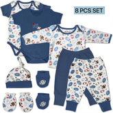 A set of baby clothes and accessories, including a blue onesie, a blue shirt, blue pants, a blue hat, and blue socks, all featuring a football pattern.