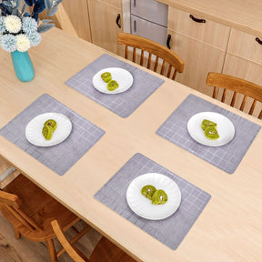 Set of 8 woven PVC placemats by TH1910615B, durable and stylish table protectors for dining.