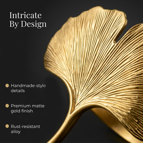 a close-up view of a gold leaf-like object, showcasing its intricate design and craftsmanship.