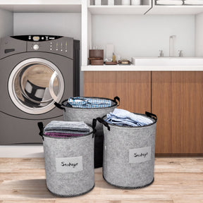 Set of 3 felt gray laundry hampers and storage bins by 4629, showcasing soft, foldable fabric with sturdy handles.