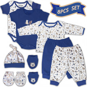 A collection of baby clothing and accessories, including a blue onesie, blue pants, a blue hat, and baby mittens, all featuring a pattern of animals and trees.